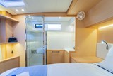 Lagoon 52 Flybridge en-suite aft bathroom with separate shower stalll & wash basin and separate ensuite heads with toilet and wash basin forward